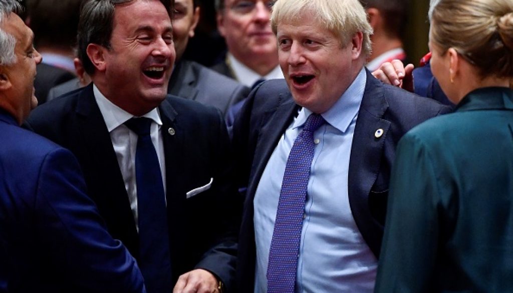 Luxembourg's Prime minister Xavier Bettel (C-L) and Britain's Prime Minister Boris Johnson (C-R) share a laugh during an European Union Summit at European Union Headquarters in Brussels on October 17, 2019. (Photo by John THYS / AFP) (Photo by JOHN THYS/AFP via Getty Images)