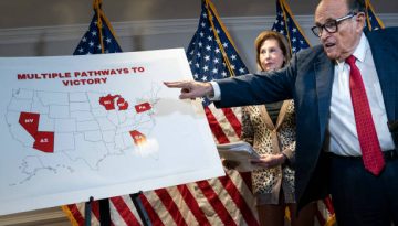 Rudy Giuliani points to a map as he speaks to the press about various lawsuits related to the 2020 election